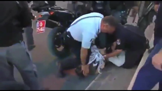 Israeli Police Kneeling On An American Jew Activist (IDF Restraining Technique)