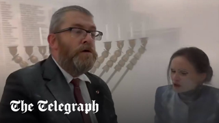 Polish MP uses fire extinguisher to snuff out Jewish menora in parliament