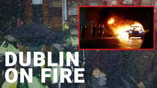 Dublin stabbing: anti-immigration protesters clash with riot police, set bus ablaze