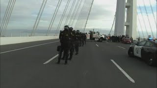 Protesters block traffic on California bridge amid APEC