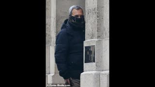 Ehud Barak hides his face as he enters entering Jeffrey Epsteins mansion