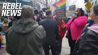 2SLGBTQIA+ protesters attempt to physically prevent Pastor Artur Pawlowski from attending the March