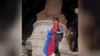 n Odessa, a woman tried to hang a Russian flag on the pedestal of the monument to Catherine II