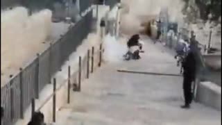 A stun grenade thrown by Israeli soldier directly at Palestinian girl on the stairs of Damascus Gat