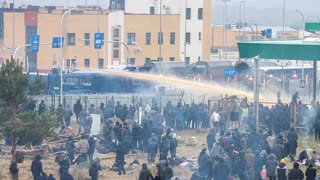 Poland turns water cannons on thousands of migrants as tensions rise at Belarus border