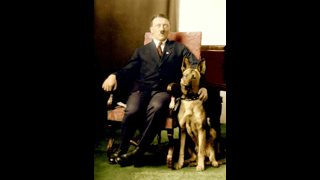 34-year-old Adolf Hitler flanked by his Alsatian, Prinz