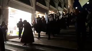 Genocidal birds head haggadah  plague doctors white candles Illuminated procession Mocking the masses on the Venice streets 2018