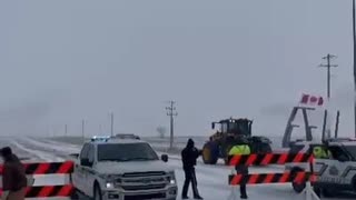 Farmers break through RCMP barricades setup near Coutts Alberta to help support the border blockage