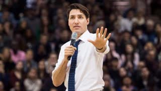 Heckler interrupts Prime Minister Trudeau, calling him a "traitor to Canadians